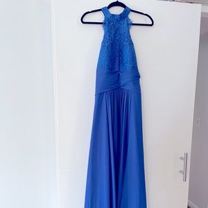 Royal blue, floor length, halter dress with lace details at the top!